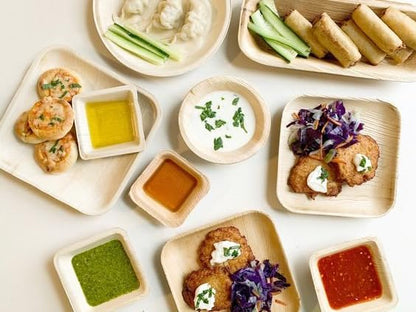 Palm leaf plates and bowls set for disposable eco-friendly dining